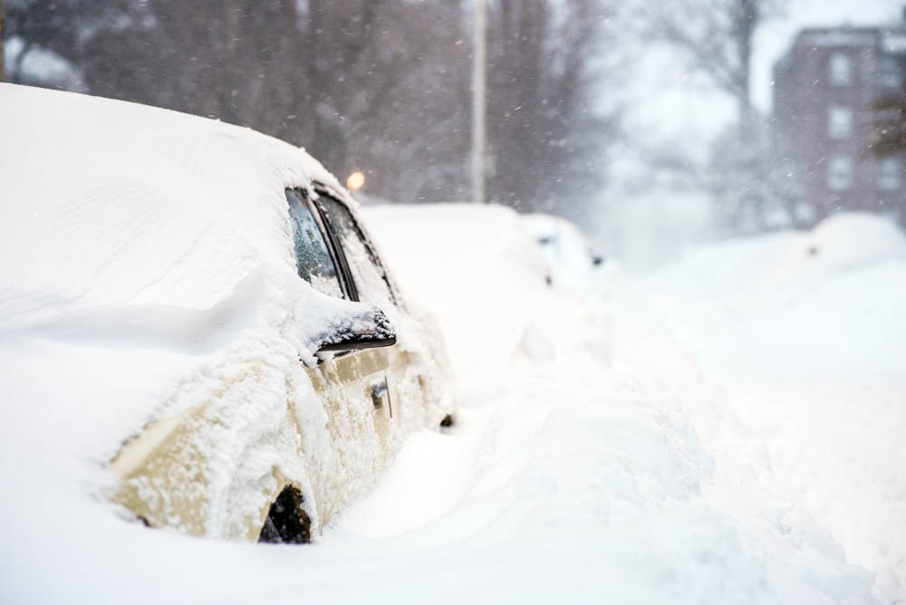 Car stuck in snow on Ware St, Cambridge in Harvard Square
